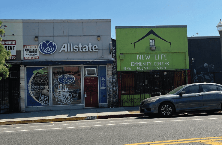 Allstate Insurance Office Next To New Life Community Center On An Urban Street